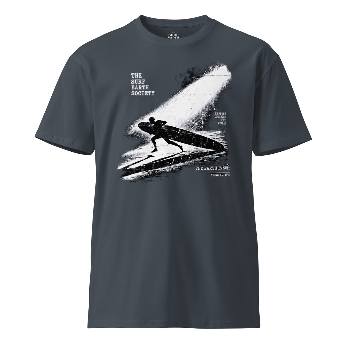 Vintage 100 cotton surf T-shirt featuring a longboard surfer entering the ocean under a dramatic spotlight petrol blue color