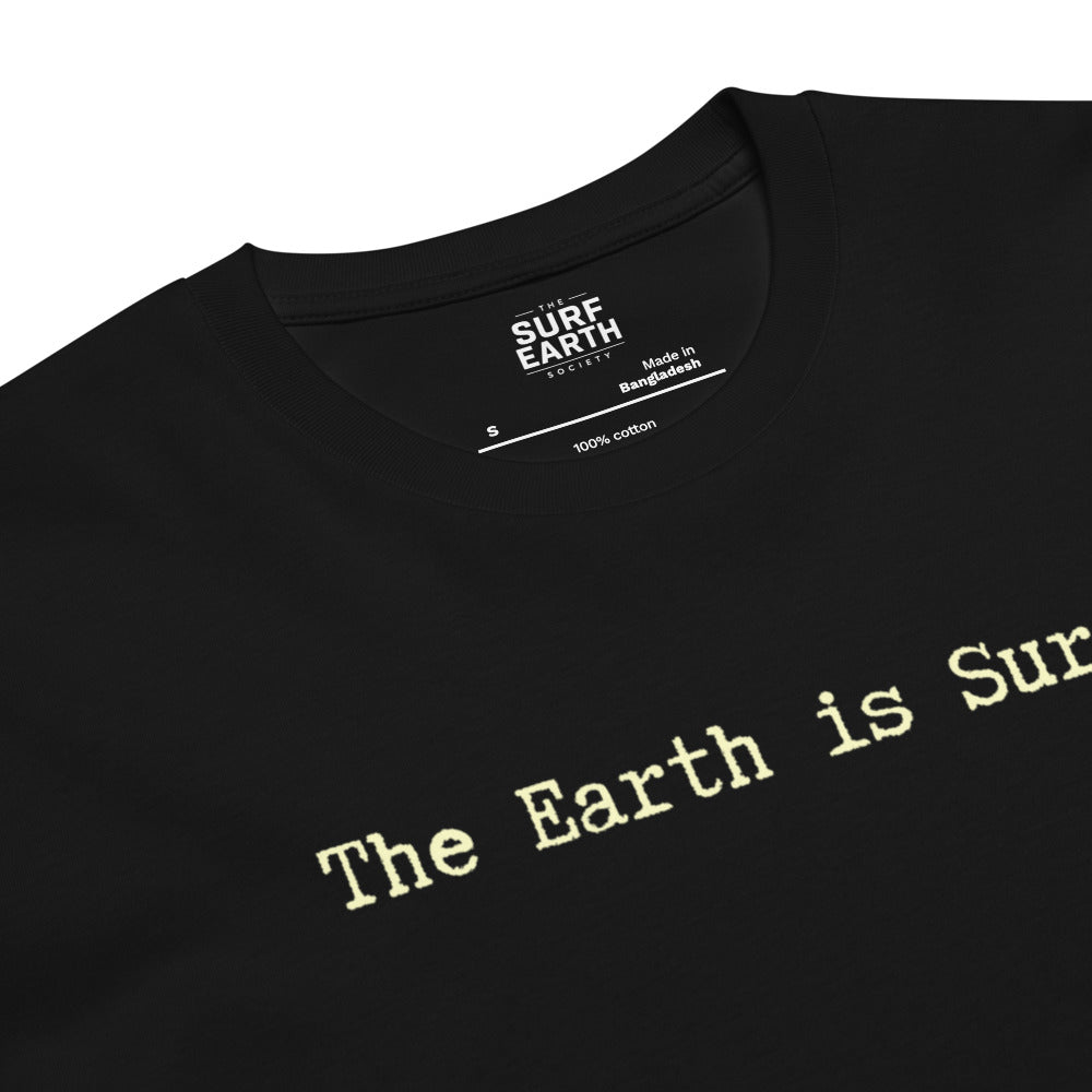 Close-up of a black crewneck t-shirt with the phrase 'The Earth is Surf"