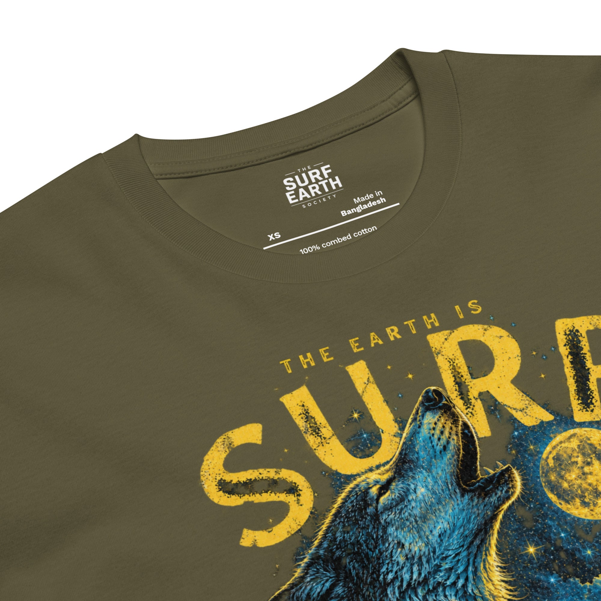 close-up army green tee Retro 1990s wilderness surf T-shirt graphic with wolves, pine trees, moon, and ocean wave
