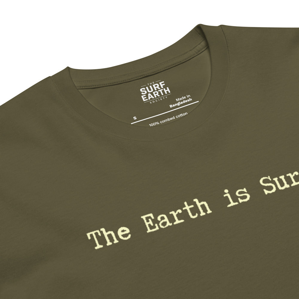 Close-up of an olive green t-shirt with the phrase "The Earth is Surf." simple type